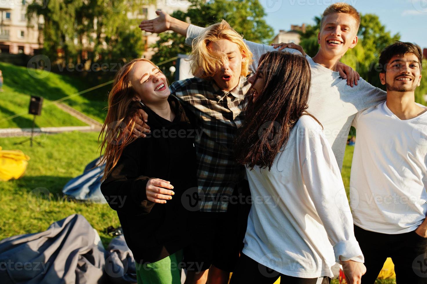 Young multi ethnic group of people in open air cinema. photo