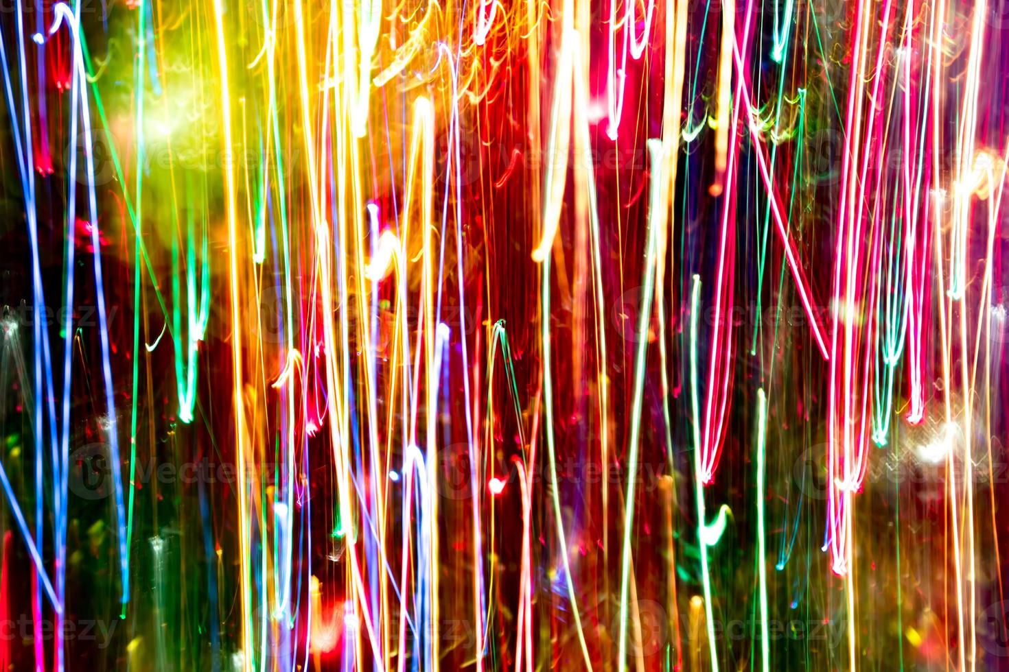 Abstract burred texture background of colorful bokeh motion. Long exposure of small neon lights photo