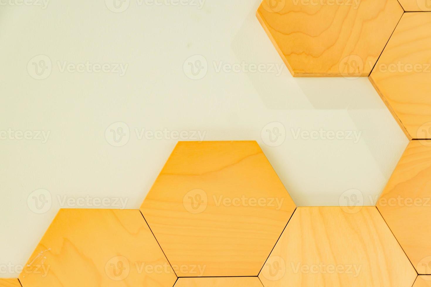 Fragement of interior decoration. Wall with wooden honeycomb. Trendy design. photo