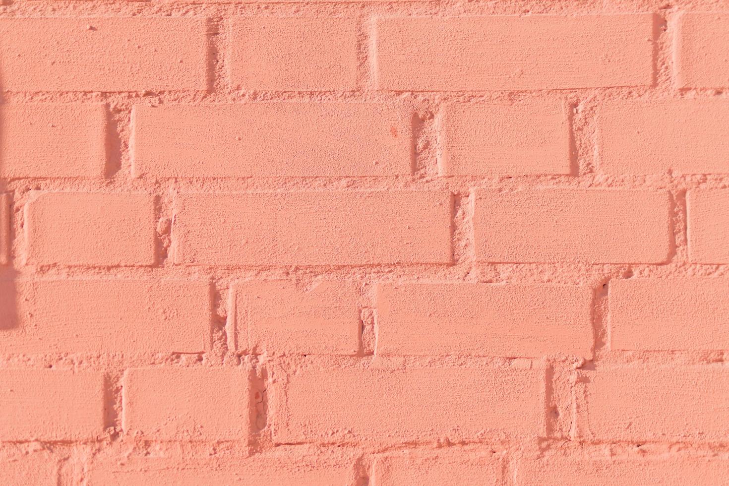 painted red brick wall texture background, close up photo