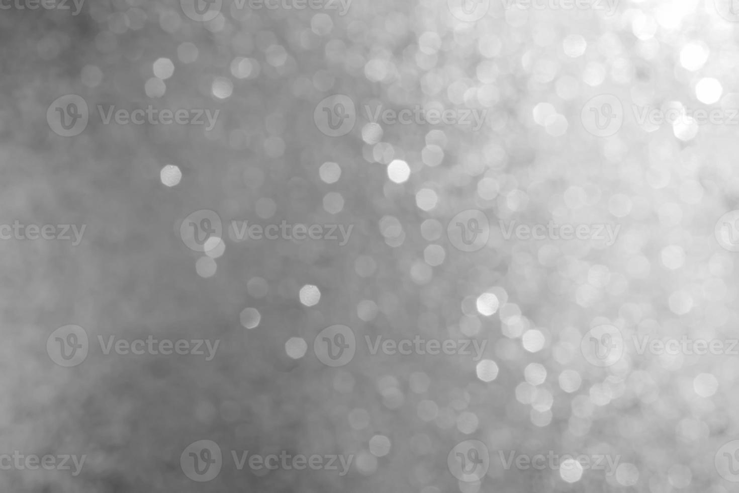 Bokeh abstract texture. Beautiful christmas background in silver colors. Defocused photo