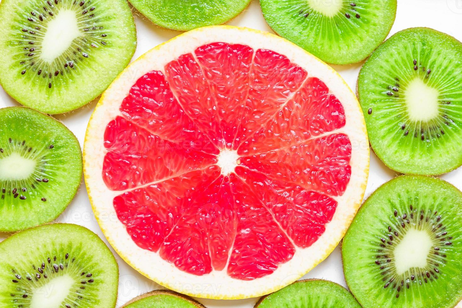 citrus slice - kiwi, oranges and grapefruits on white background. Fruits backdrop photo