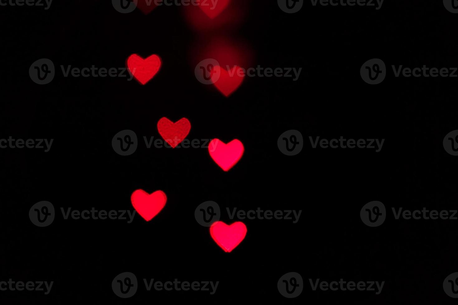 Heart bokeh background, Love and Valentine day concept. Red Shiny hearts light photo