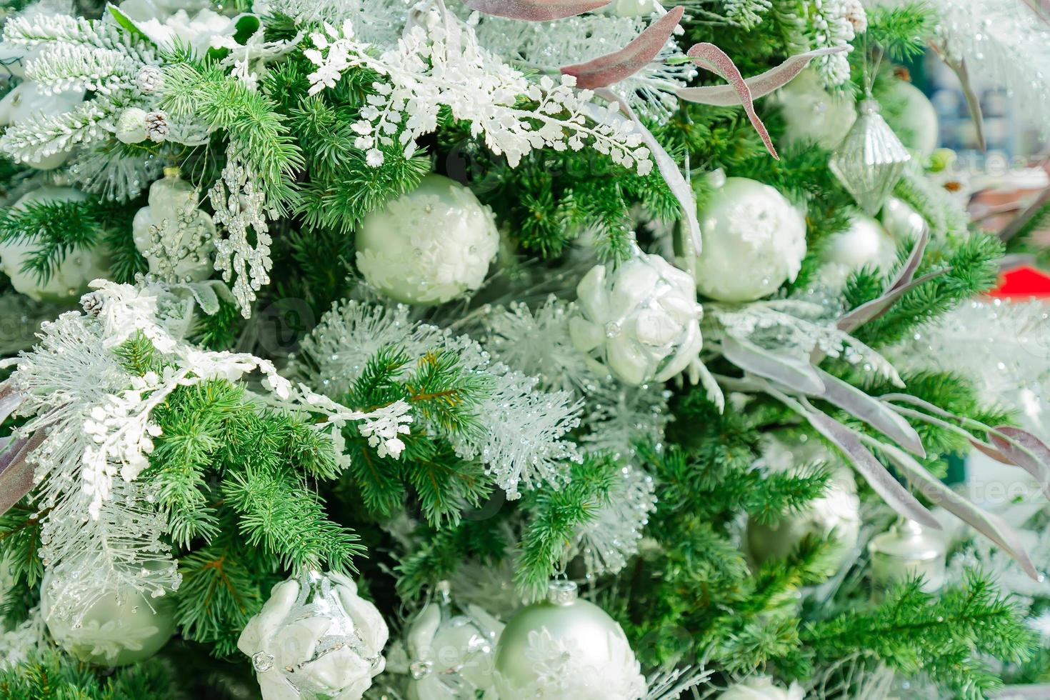 Christmas and New Year holidays background. Christmas tree decorated gold baubles and garlands. Glittering and sparkling. Celebration concept photo