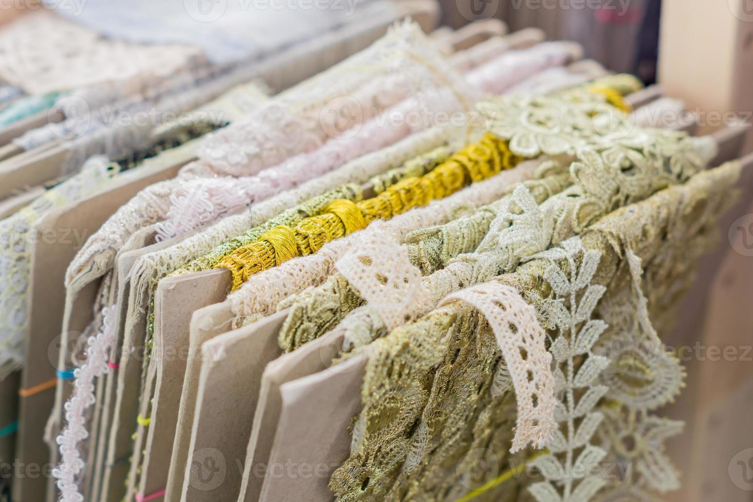 Variety of colorful lace displayed for sale at market photo