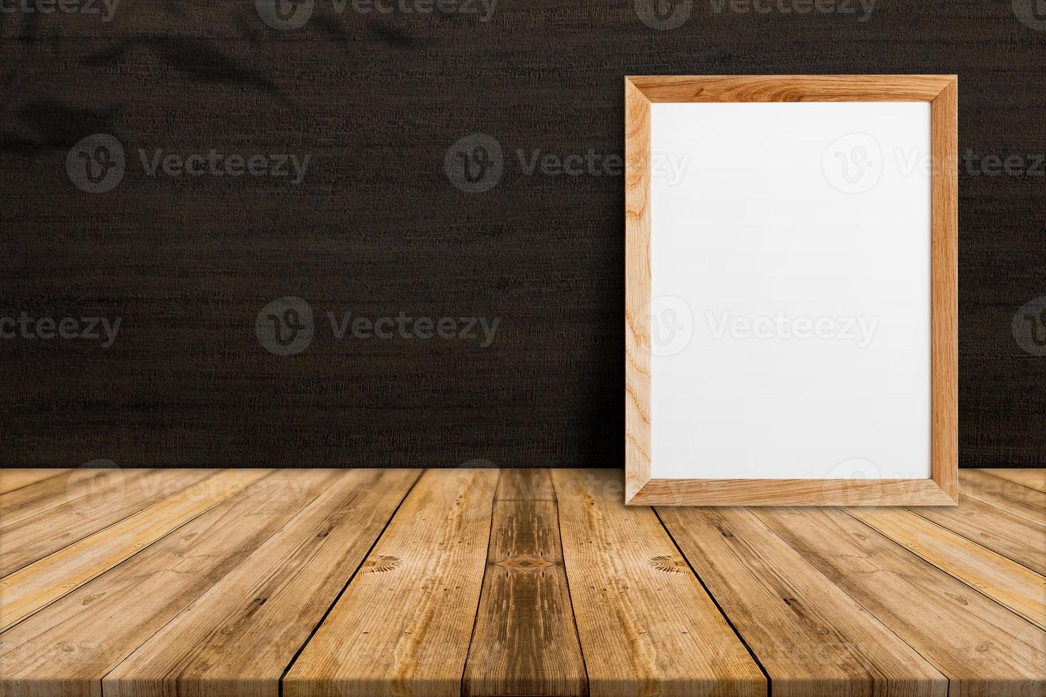 Blank wood frame on tropical wood floor and Dark brown wood wall,template mock up for adding your content photo