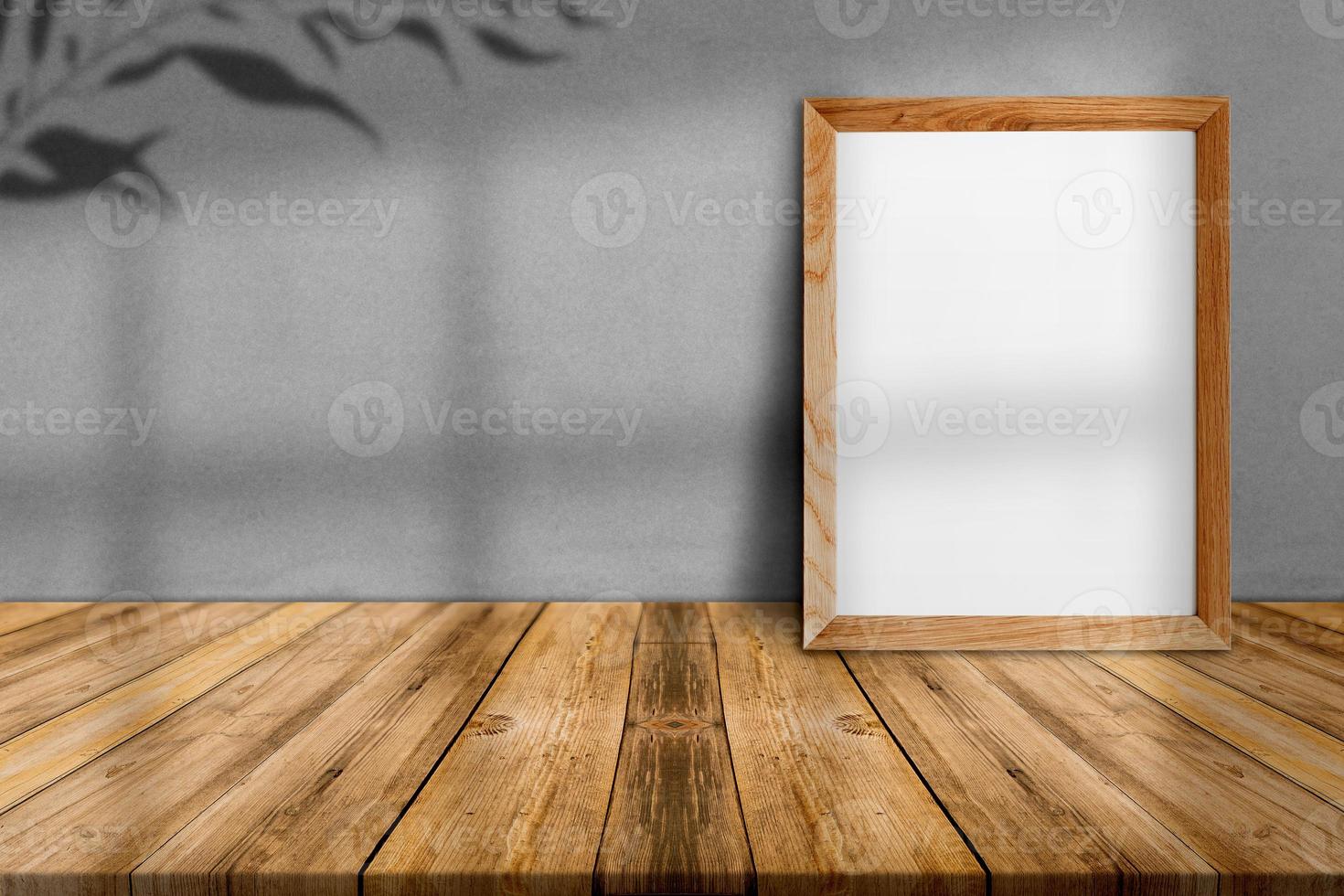 Blank wood frame on tropical wood floor and grey paper wall,template mock up for adding your content photo