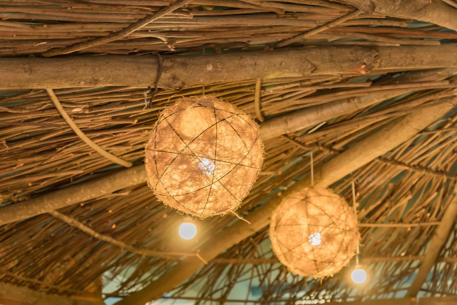 close up of roof of hay rural house with lanterns photo