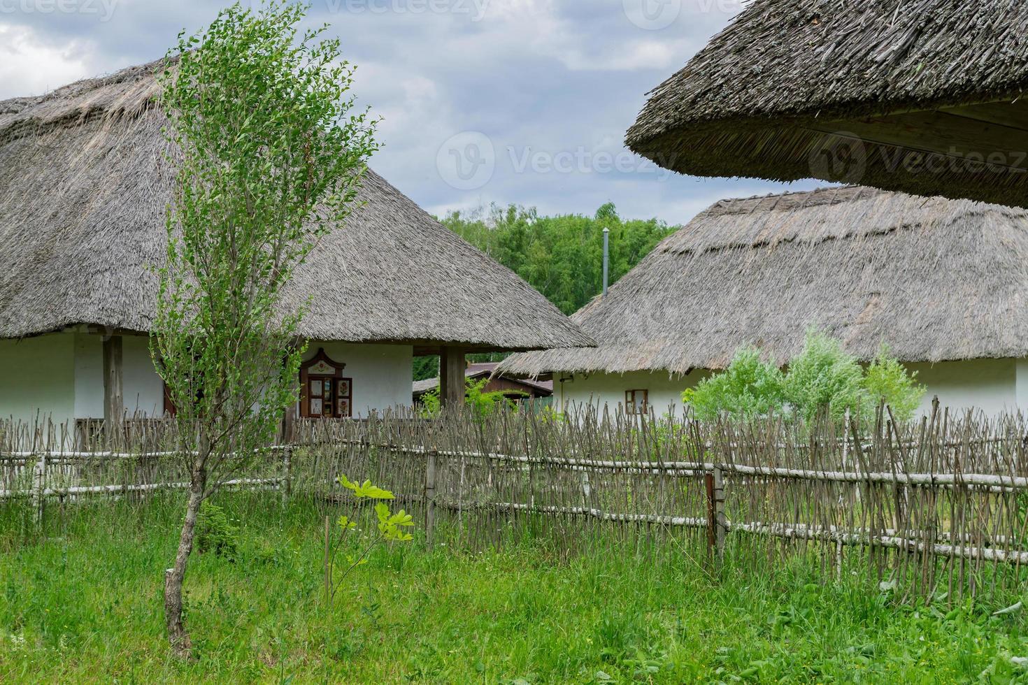 Traditional ukrainian rural house with the straw roofs, Ukrainian hamlet photo