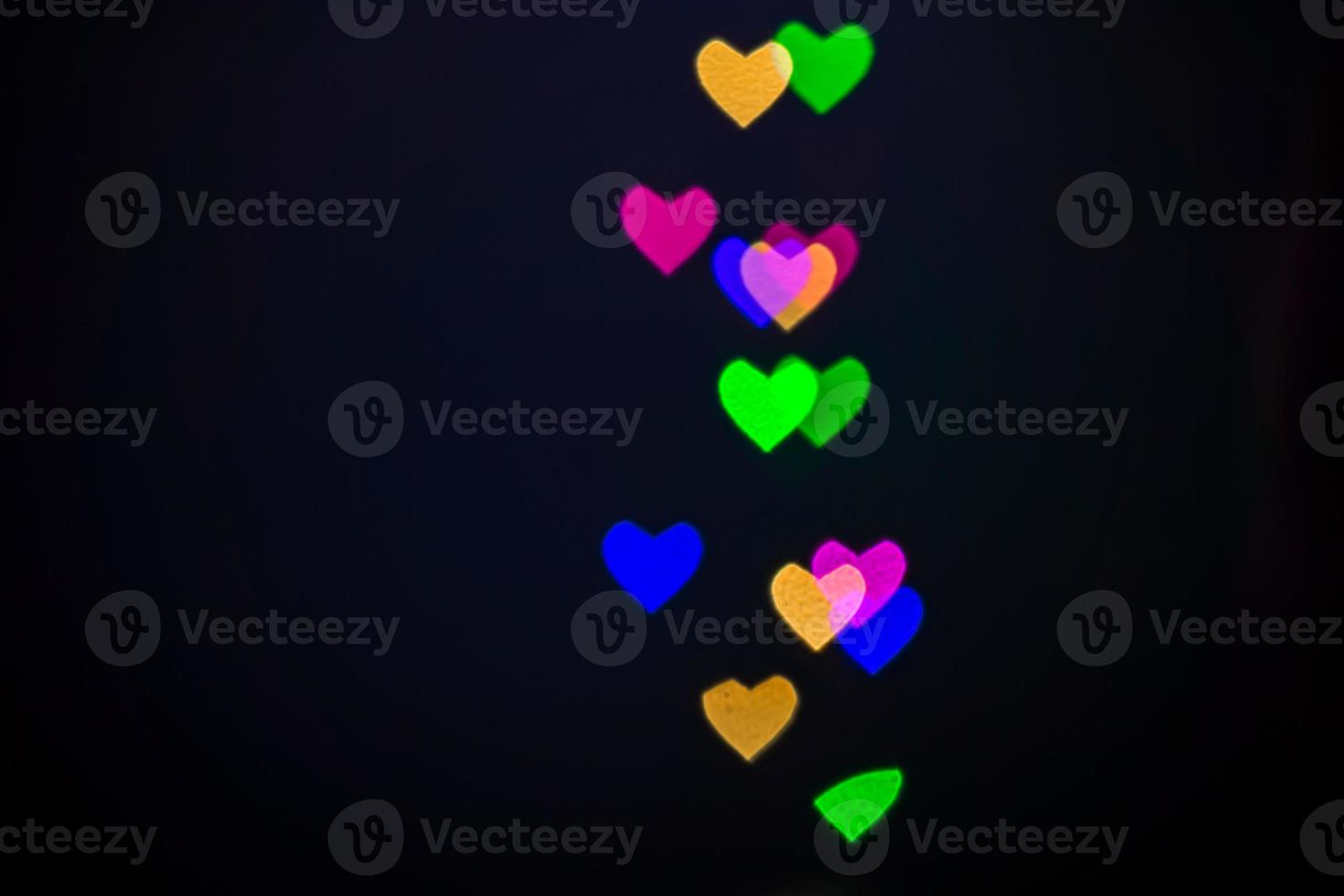 Heart bokeh background, Love and Valentine day concept. Multicolored Shiny hearts light photo