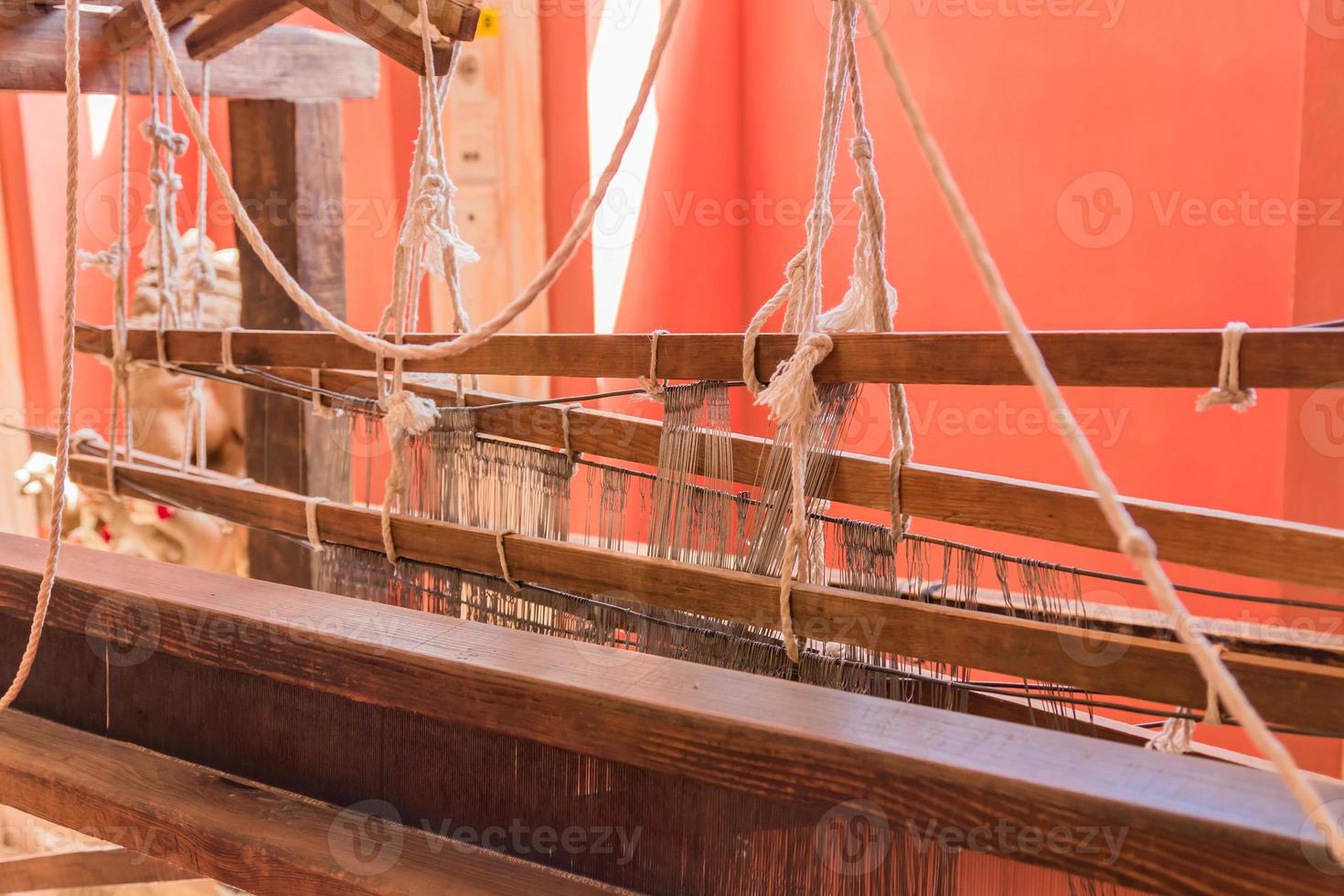 close up of arabic loom for weaving carpet in the room photo