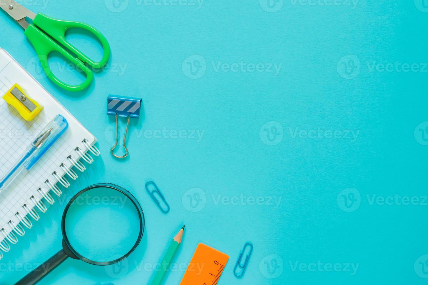 Back to school concept school office supplies on blue background