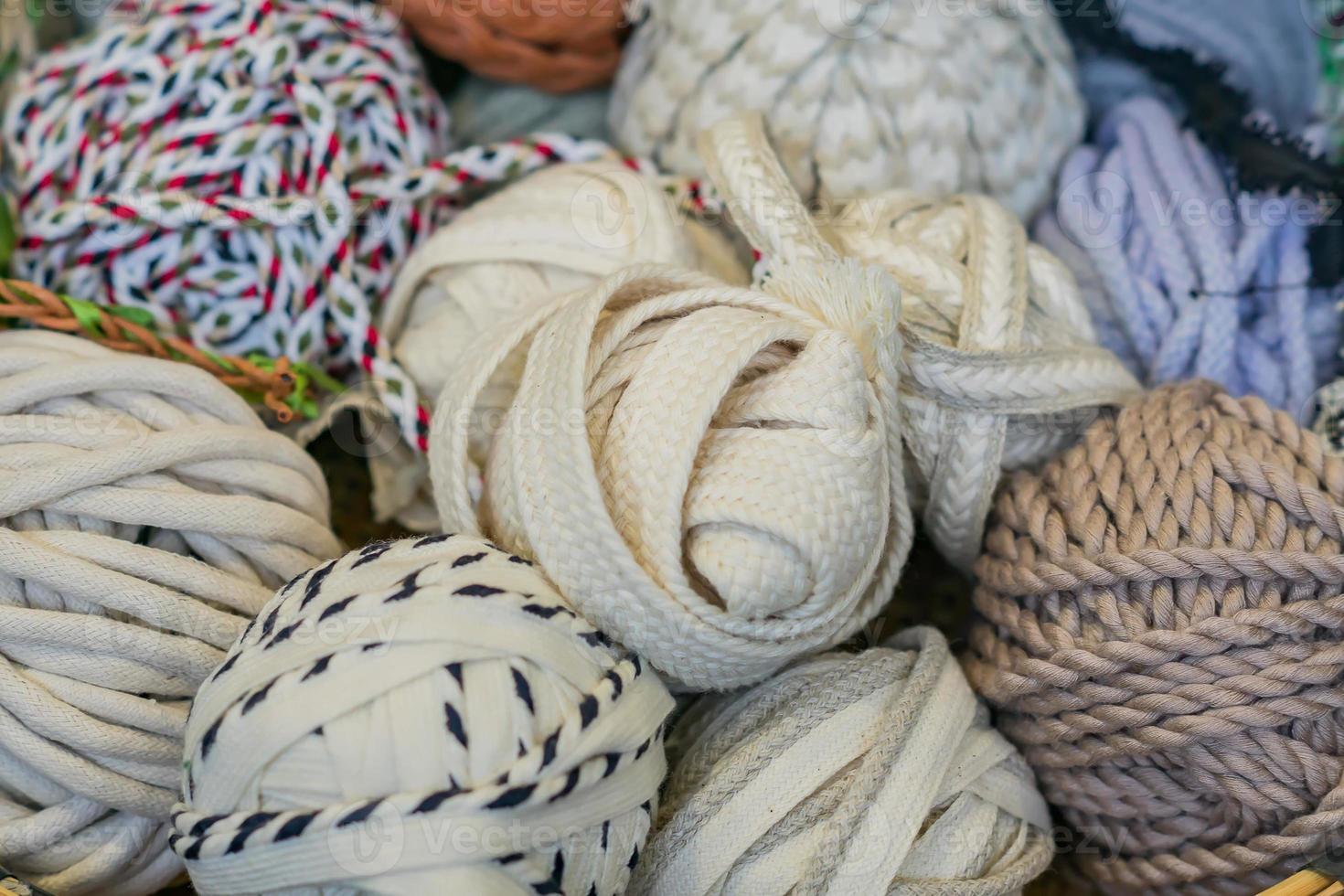 an assortment of cord rolls for handmade and craft. photo