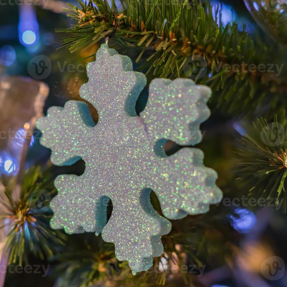 Christmas and New Year holidays background.  Christmas tree decorated with snowflake. Celebration concept photo