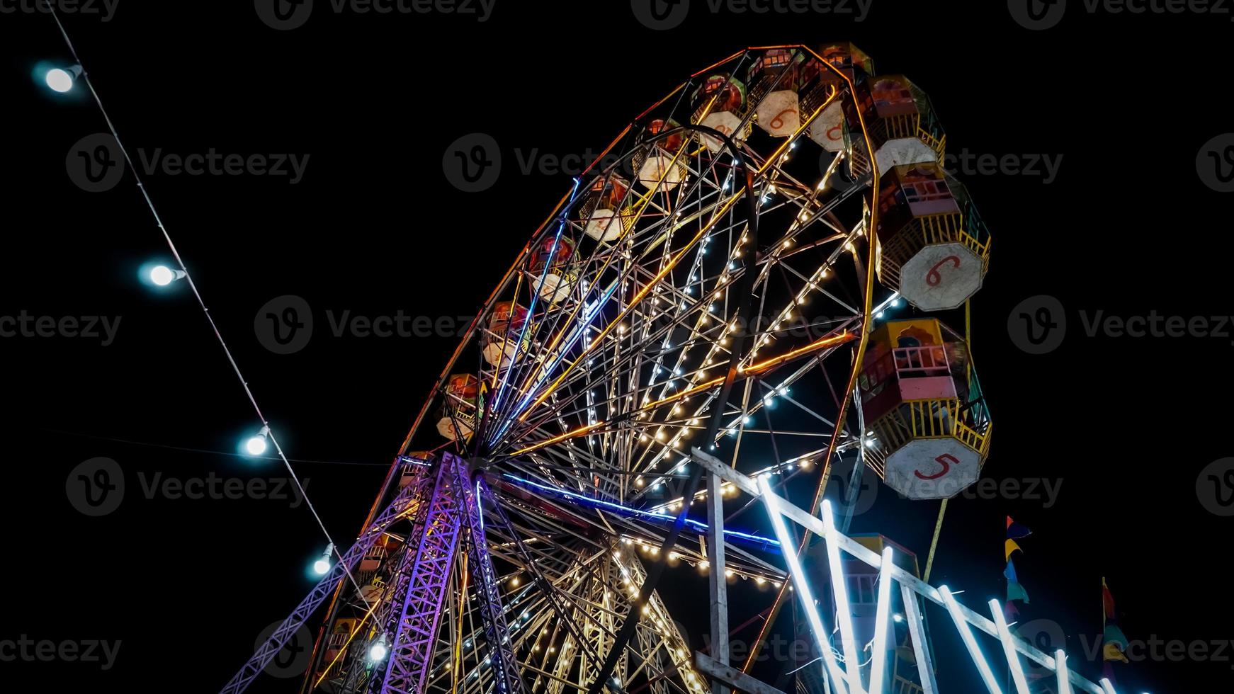 image of big swing in indian fair event. photo