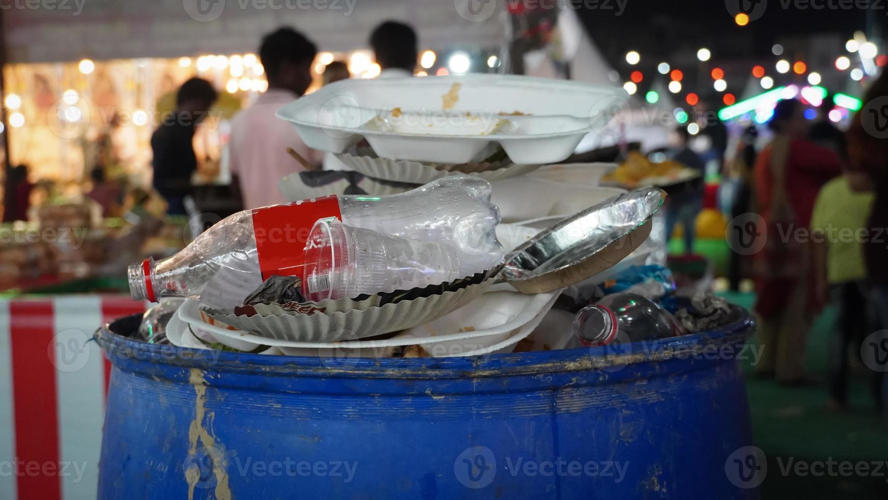 image of full dustbin after party. photo