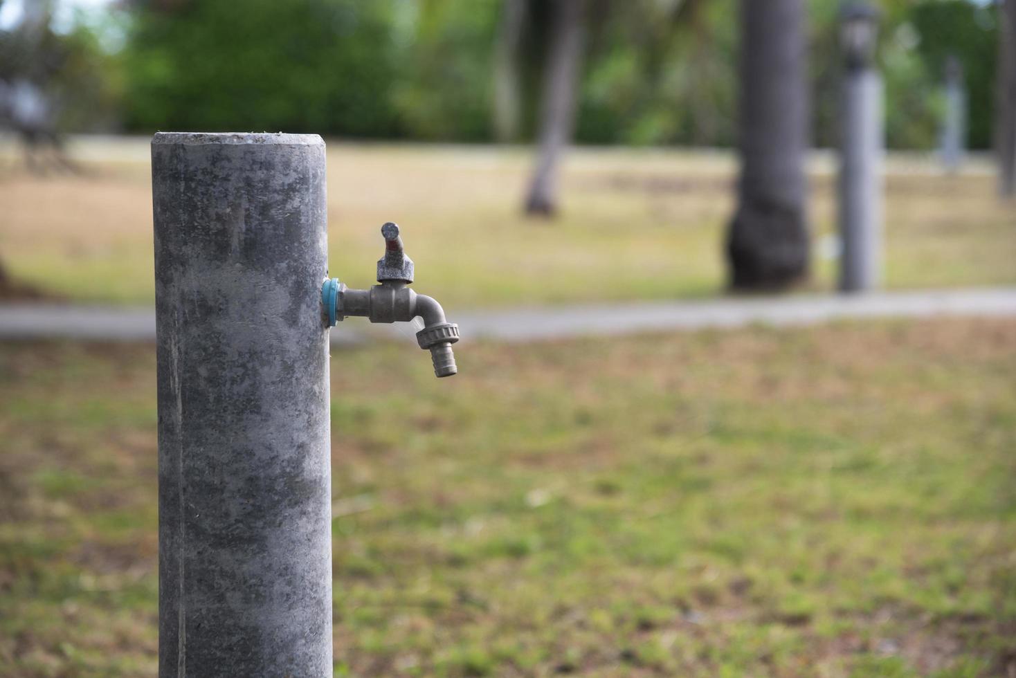 An old water tap in the park photo