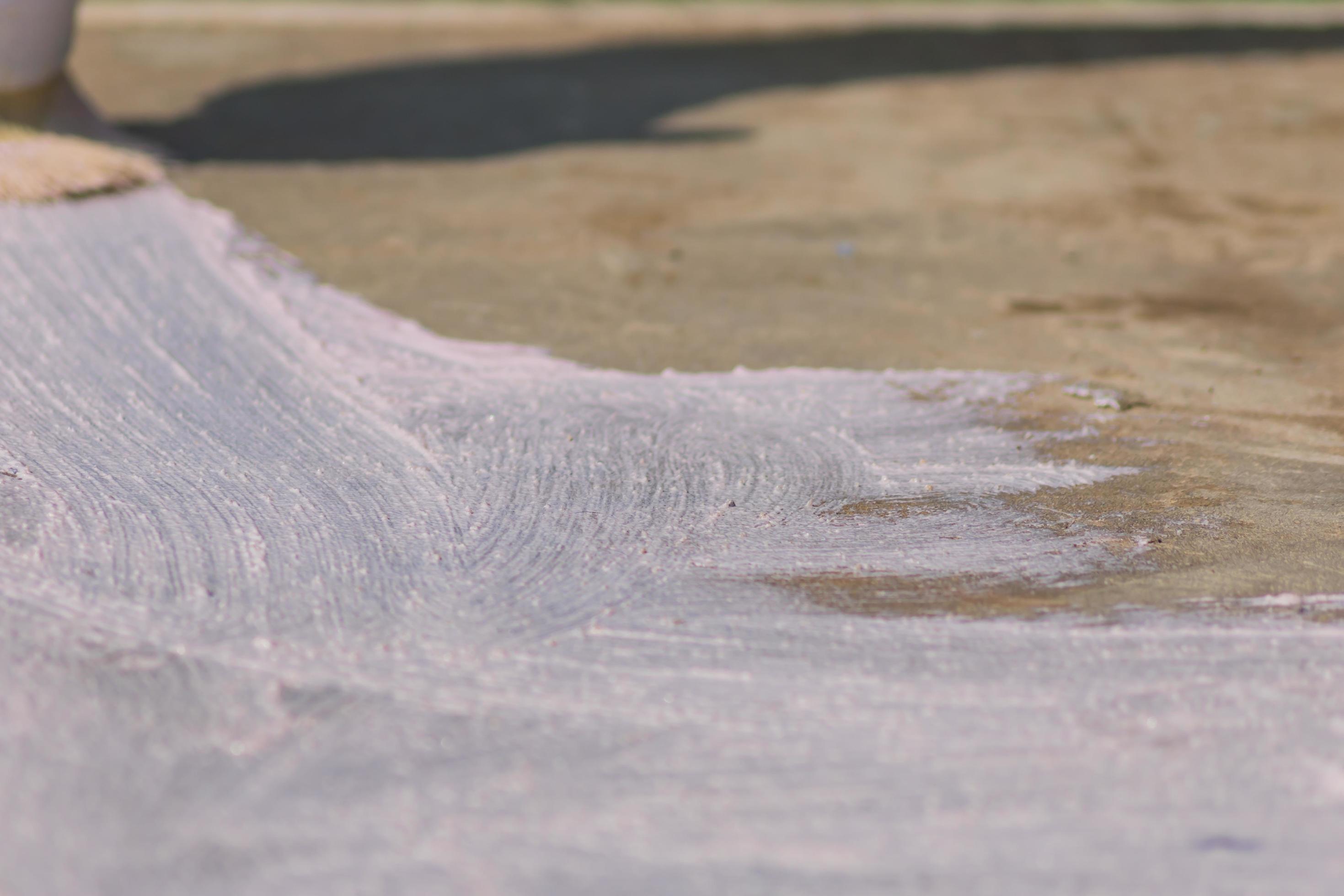 close up of concrete floor covered with primer before laying tile