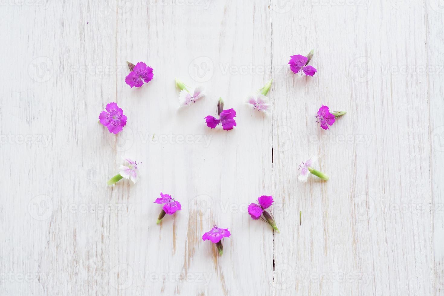 Chamaenerion flowers on white wooden background photo