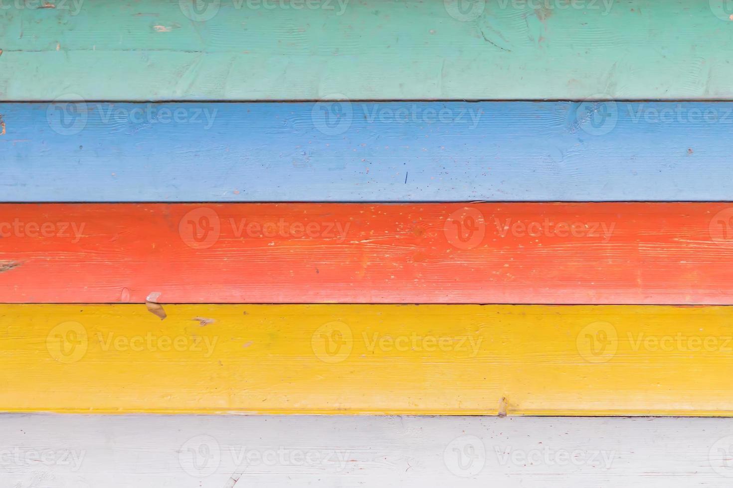 Multicolored wooden background texture. Close up of colorful fence photo
