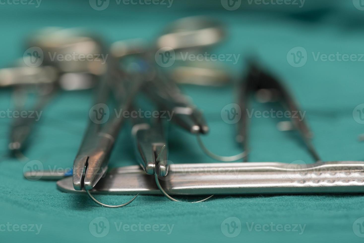 Three needle holders and empty needles photo