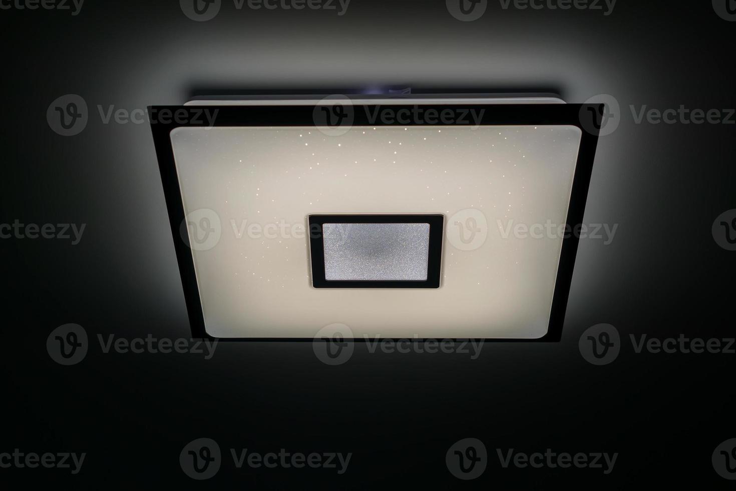 Modern luxuary square ceiling lamp with lights on photo