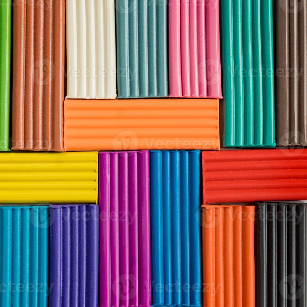 Rainbow colors of modeling clay. Multicolored plasticine bars background. photo