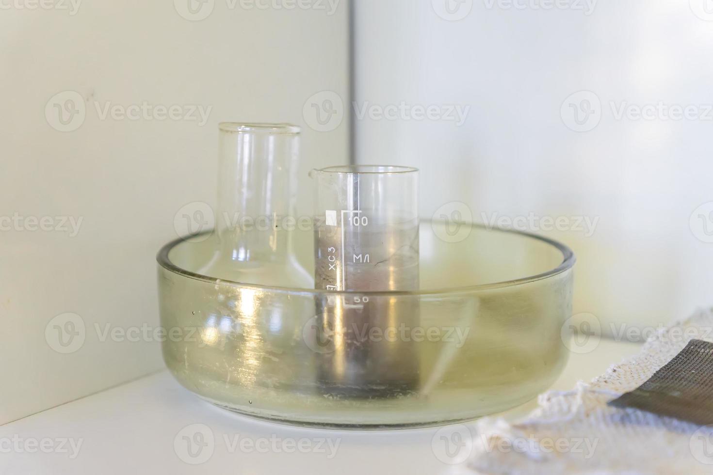 School laboratory stuff on a shelf - tube and flask. study of natural sciences photo