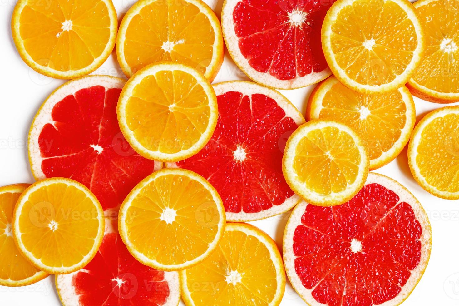 citrus slice, oranges and grapefruits on white background. Fruits backdrop photo