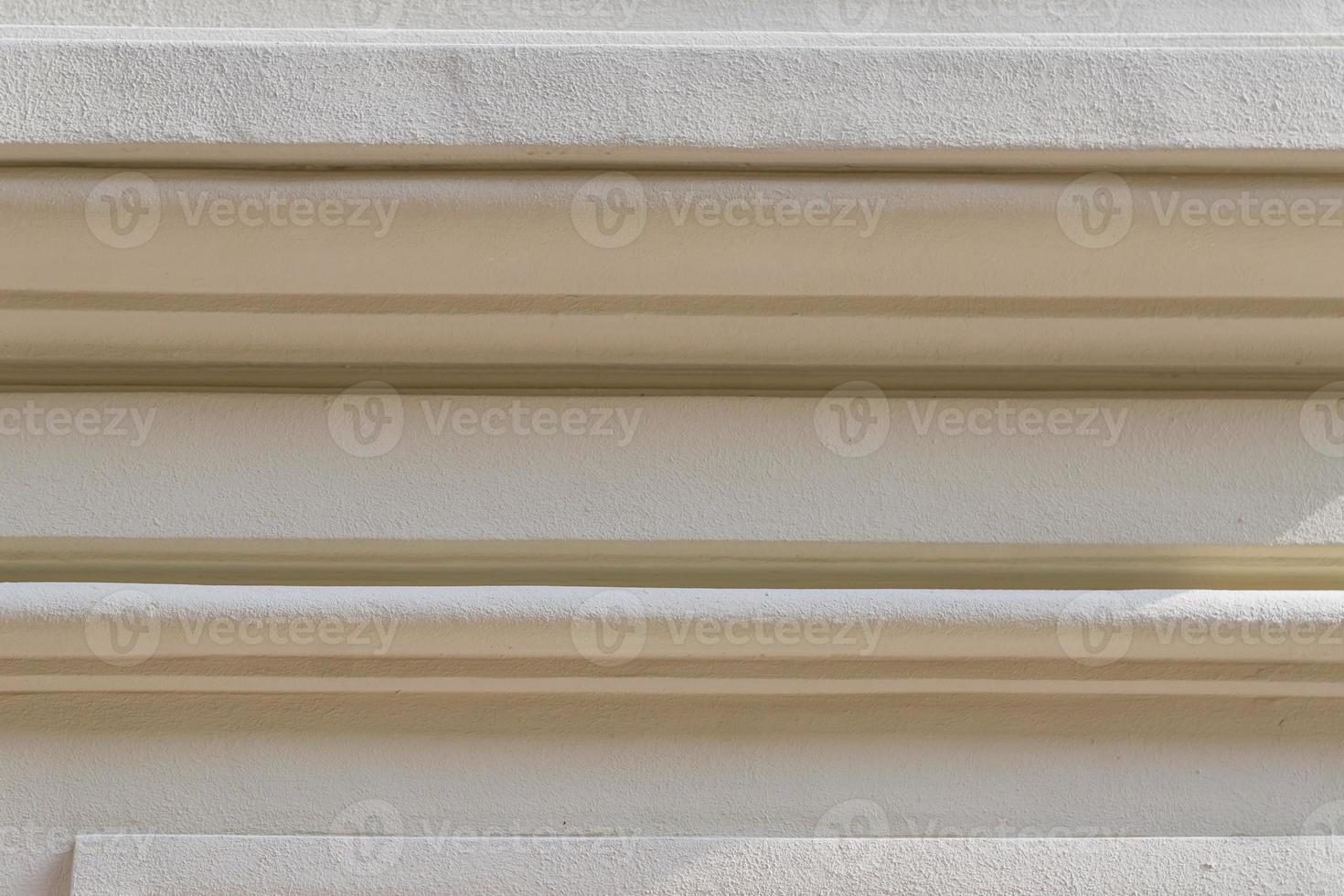 Column with stucco relief molding. Abstract background texture photo