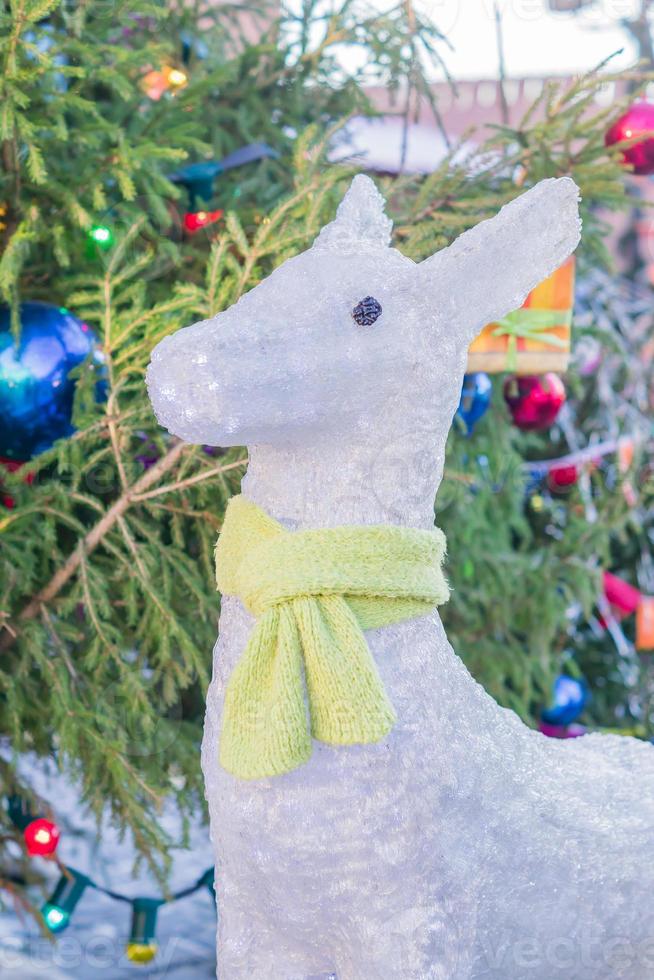 Christmas city decorations. Christmas tree and white baby deer on Red Square in Moscow, Russia photo