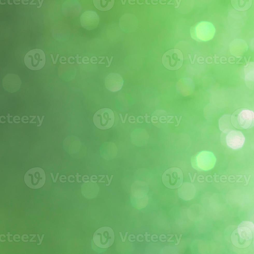 Bokeh abstract texture. Beautiful christmas background in green colors. Defocused photo