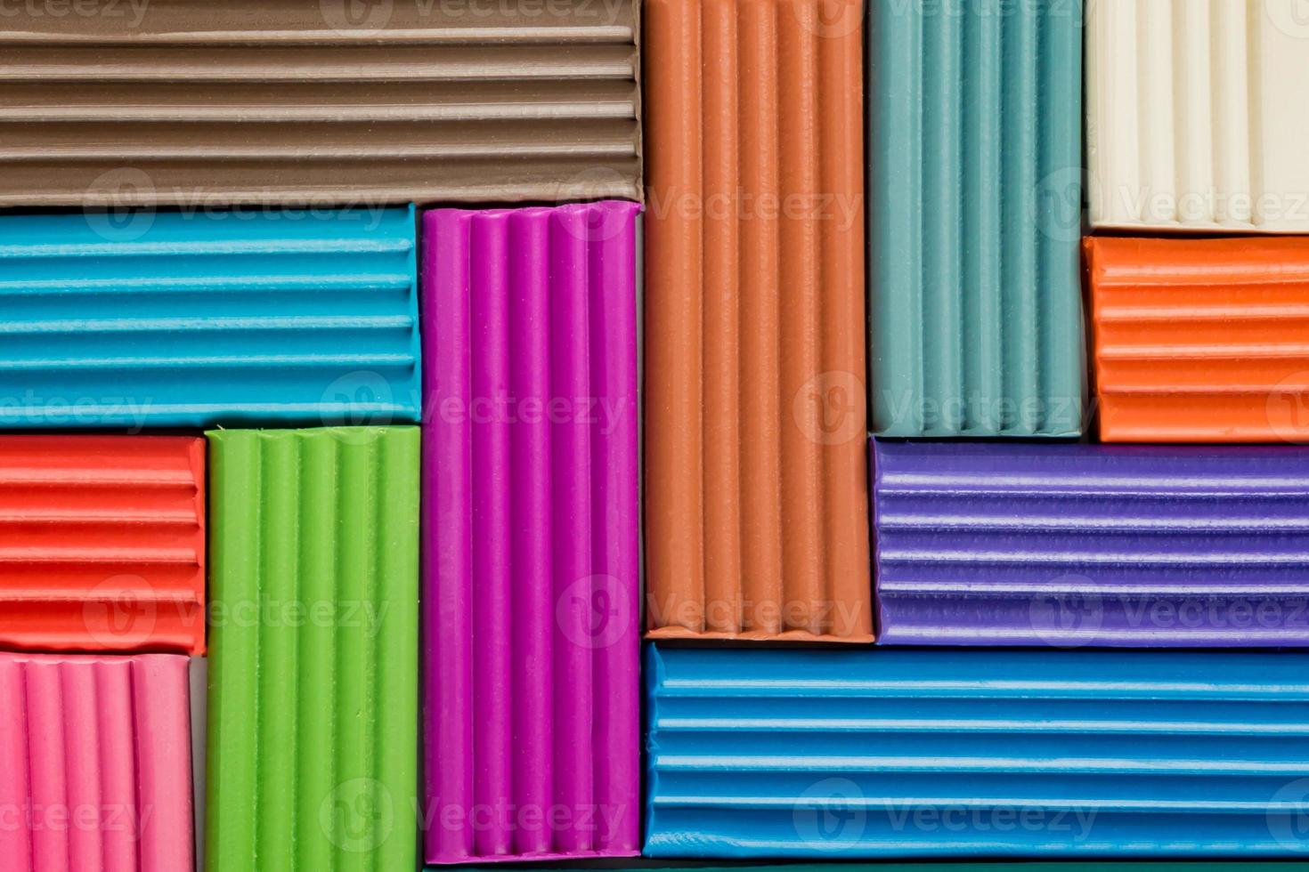 Rainbow colors of modeling clay. Multicolored plasticine bars background. photo