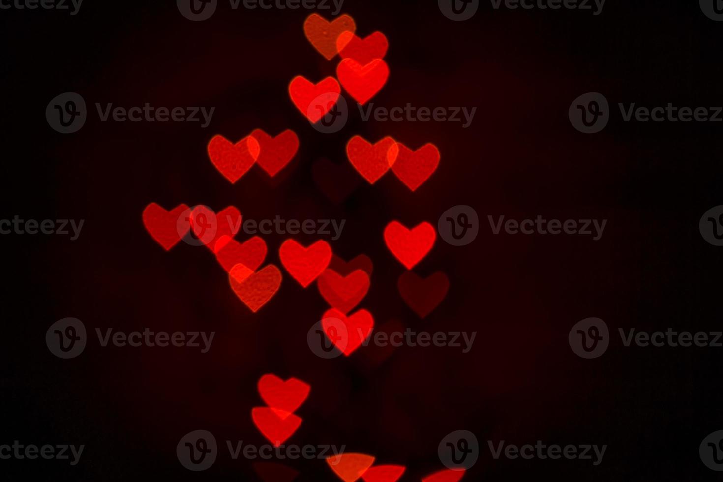 Heart bokeh background, Love and Valentine day concept. Red Shiny hearts light photo