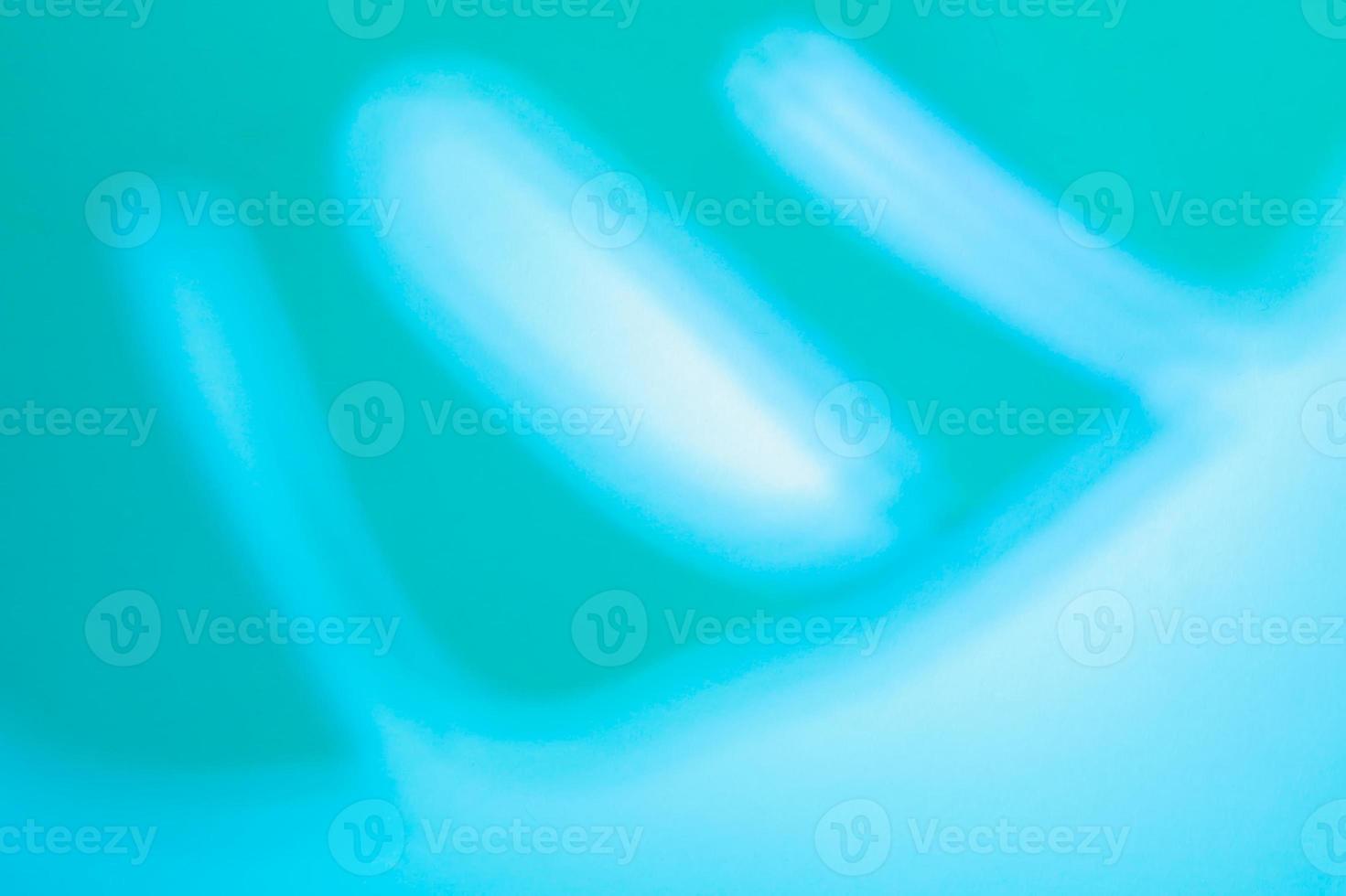 Top view of tropical leaf Monstera shadow on neon blue background. Flat lay. Summer concept with palm tree leaf, copyspace photo