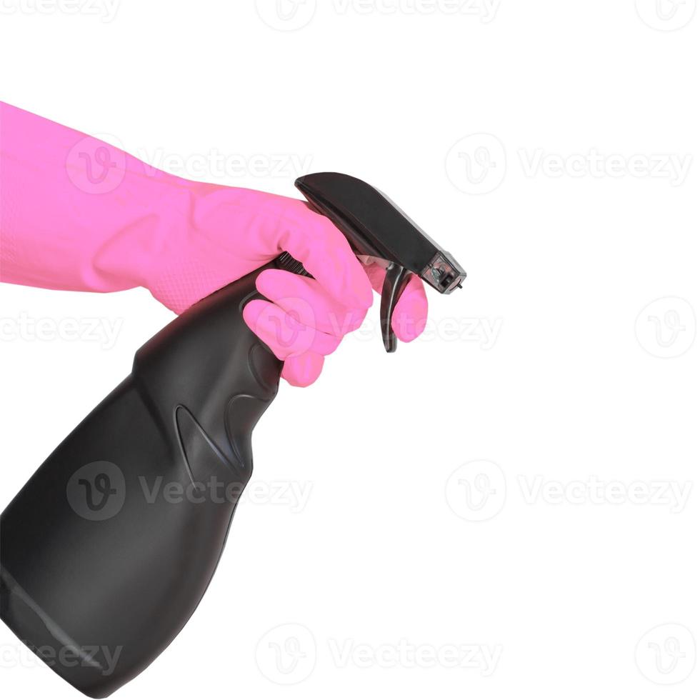 hand in pink rubber glove holding black plastic spray detergent bottle. Household chemicals. Cleaning product. photo