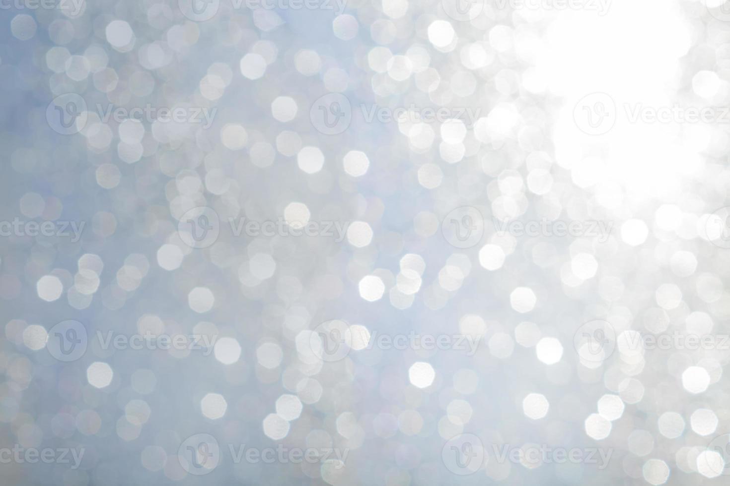Bokeh abstract texture. Beautiful christmas background in light blue colors. Defocused photo