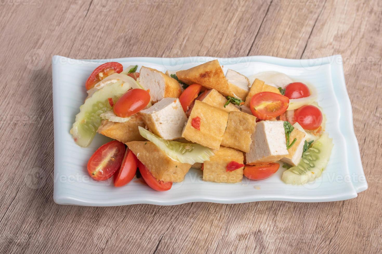 Fried tofu salad with fresh vegetables. Weight loss diet. photo