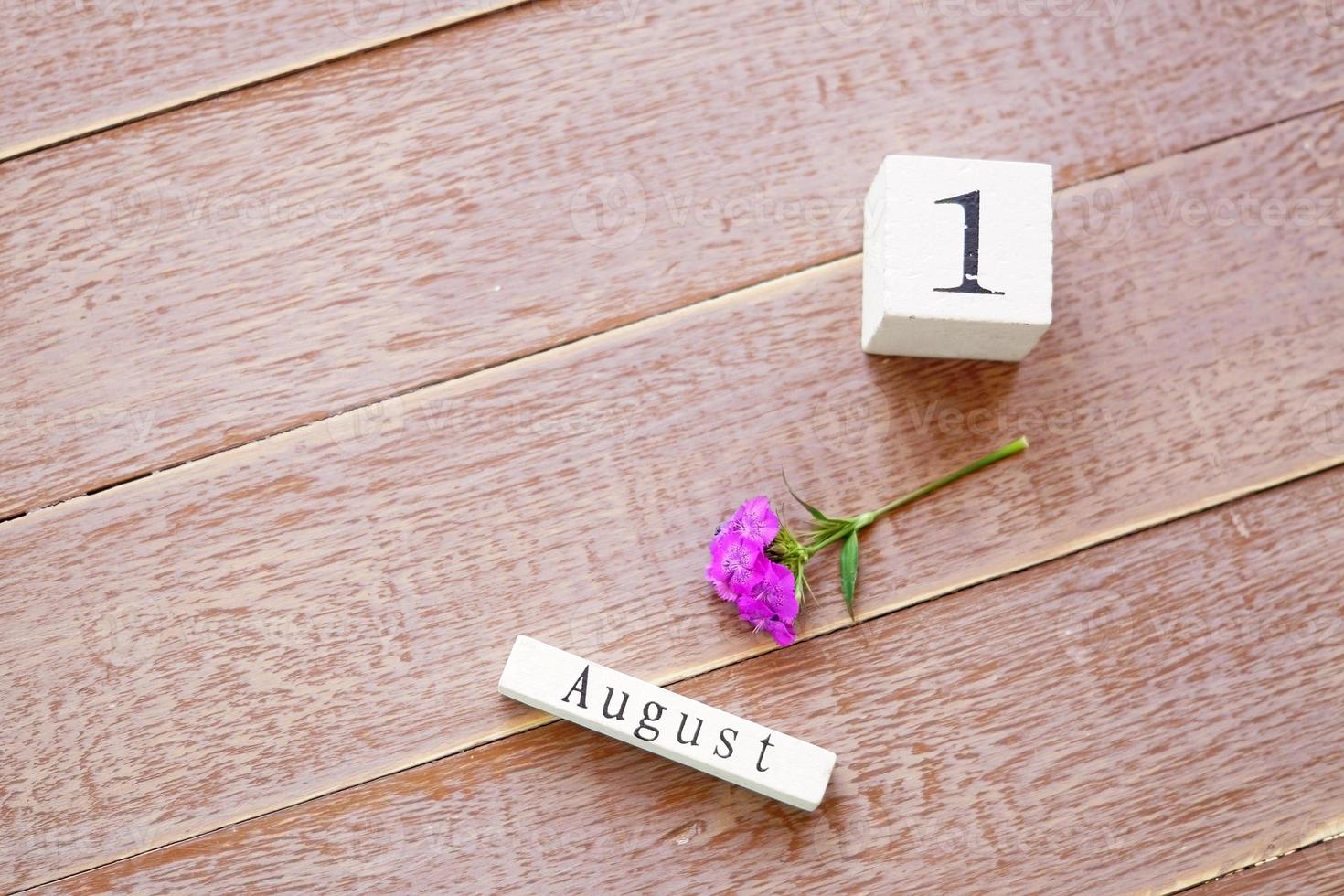 first day of August, colorful background with wooden calendar photo