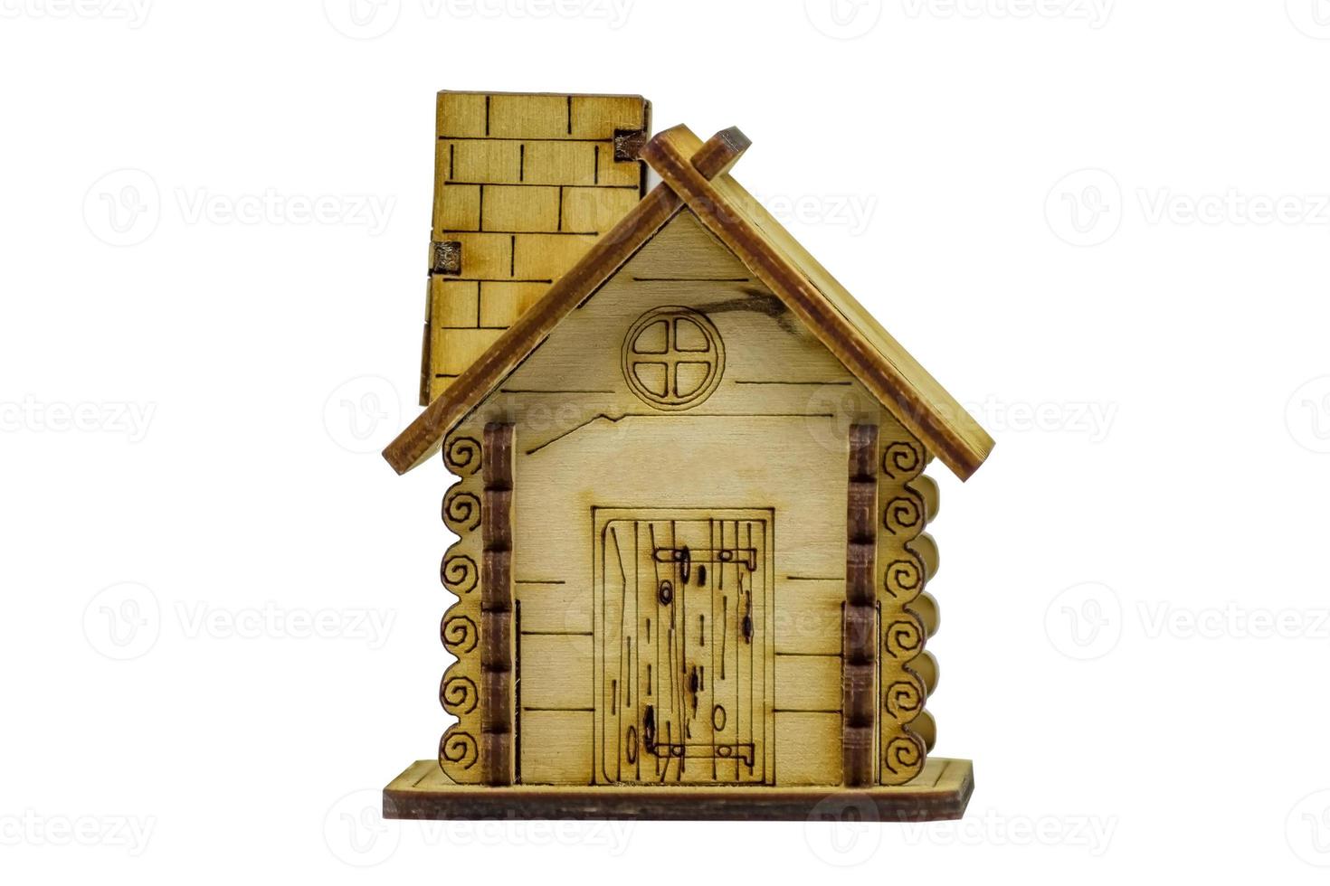 Miniature wooden house isolated on white background. photo