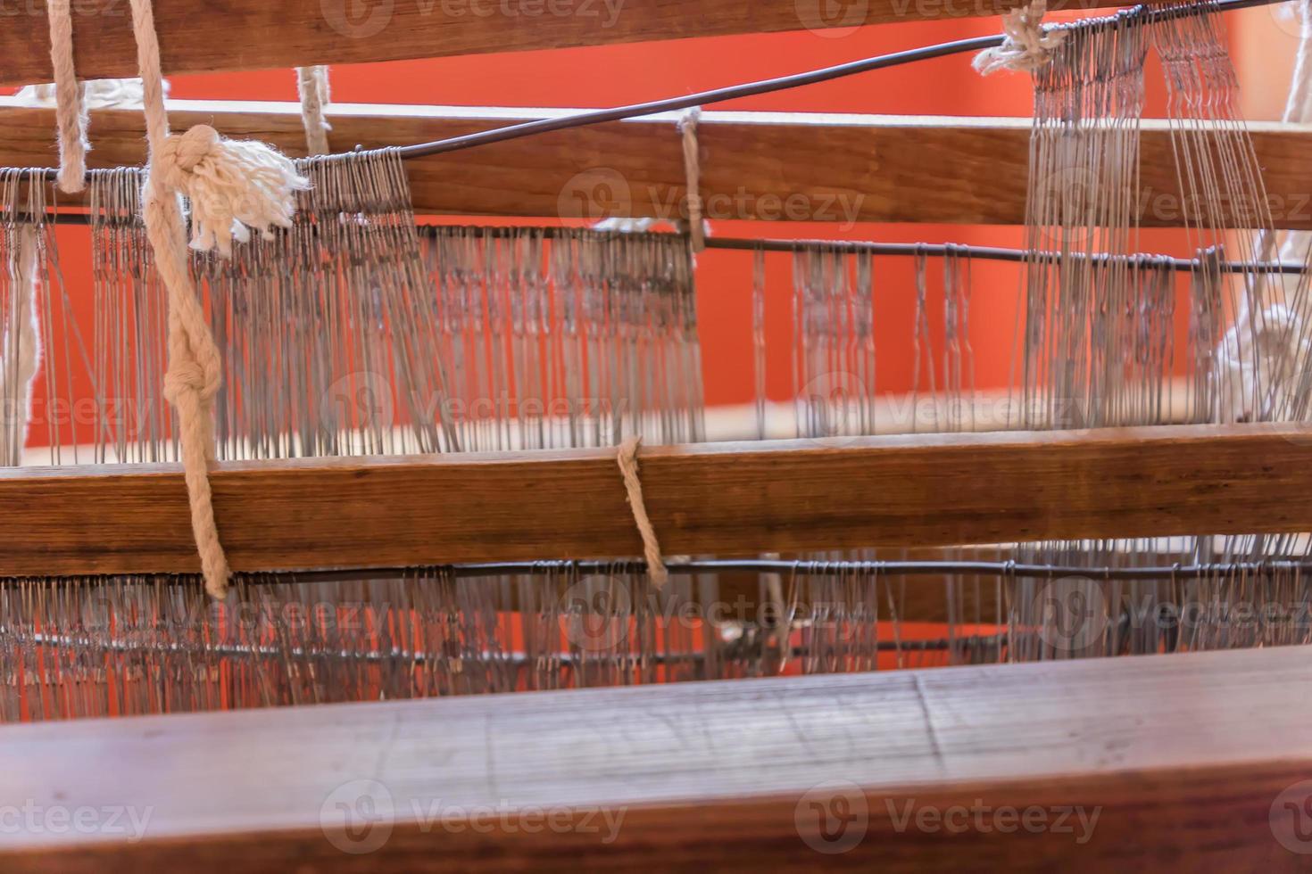 close up of arabic loom for weaving carpet in the room photo