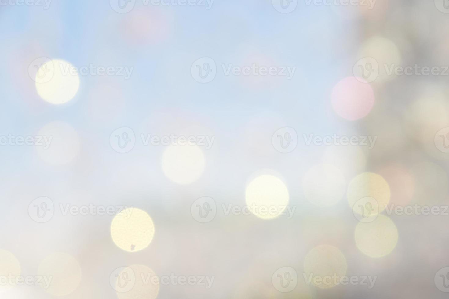 Bokeh abstract texture. Beautiful christmas background in light blue colors. Defocused photo