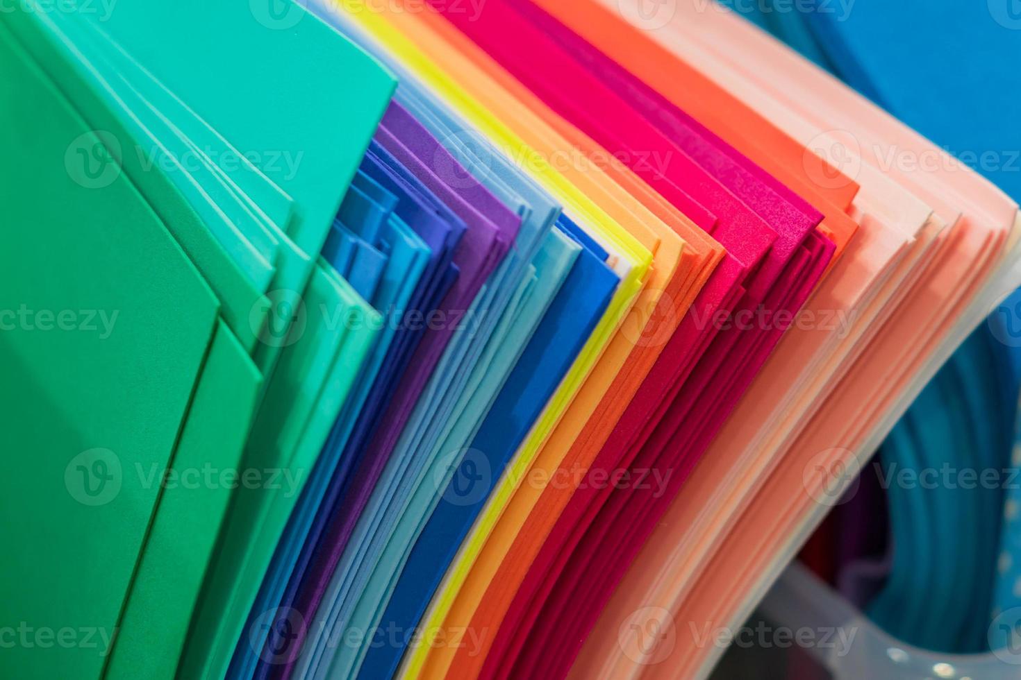 An assortment of multicolored fleece sheets for craft photo