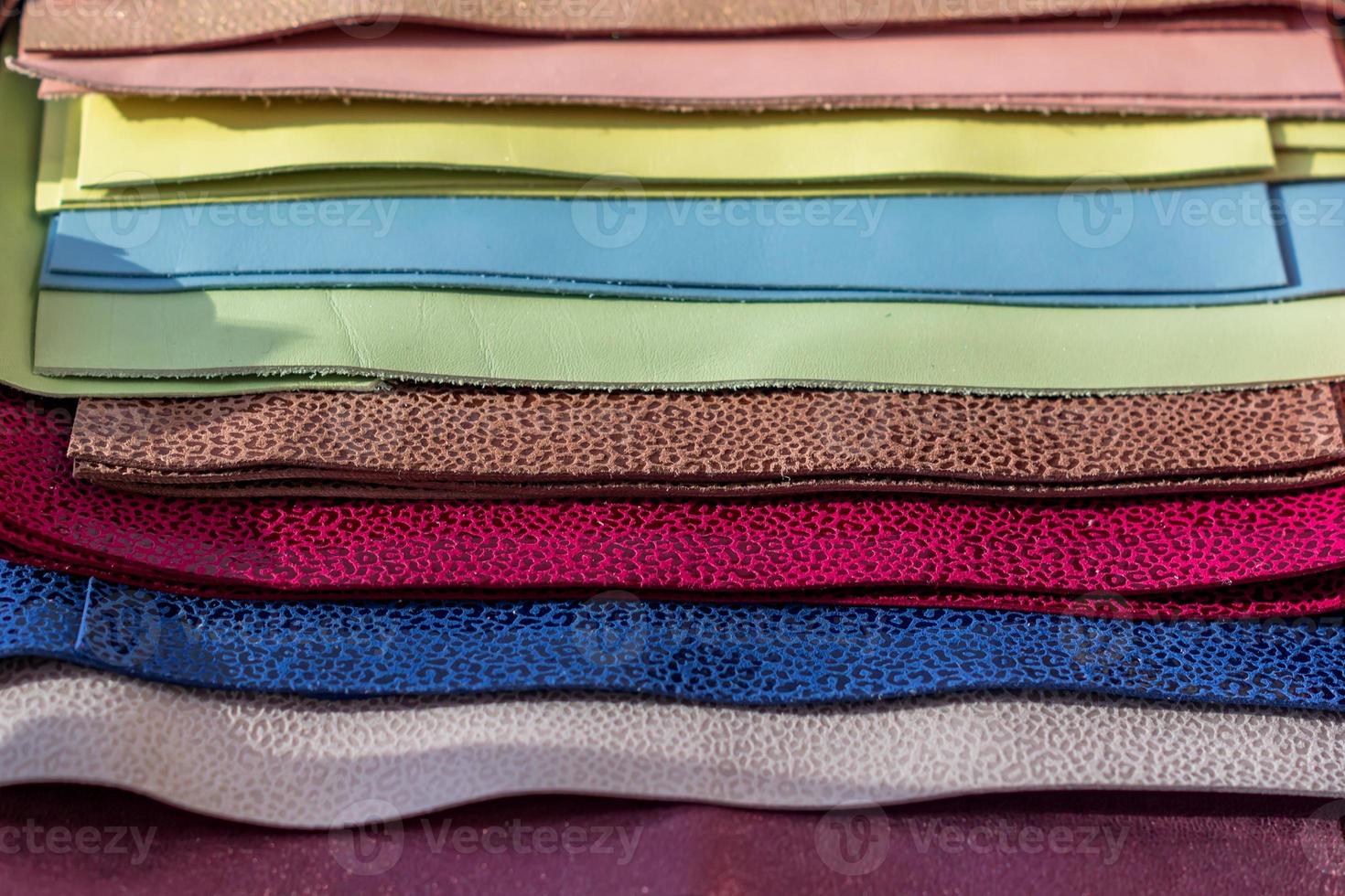 Leather samples of different colors for interior design and craft. Background texture. photo