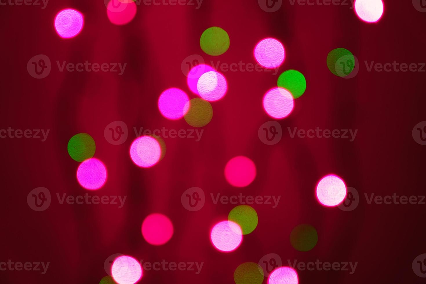 abstract blurred lights on background in pink and  green - christmas celebration concept photo