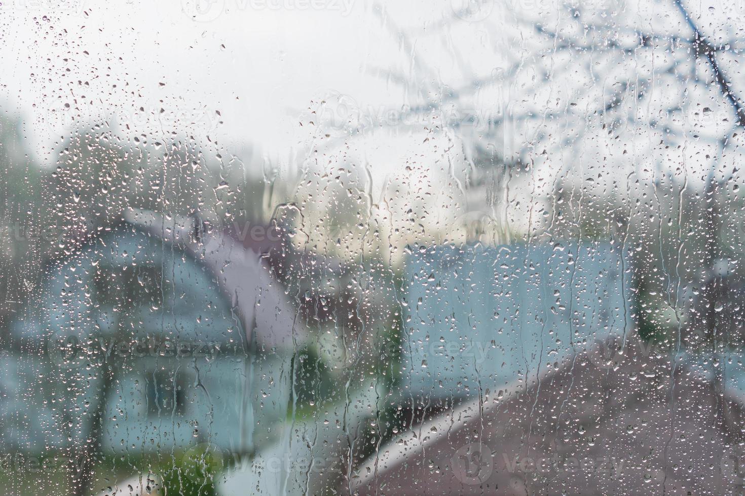 Rain drops on a window glass. Abstract background texture. photo