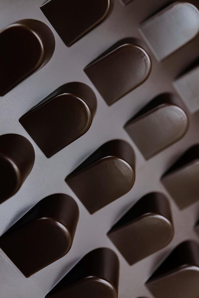 empty box of chocolate shapes. Abstract texture background photo