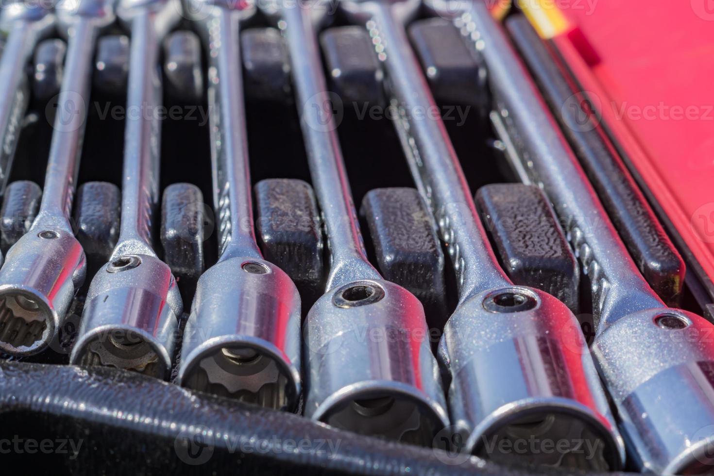 set of socket wrenches in a case,  close up of workers tools, selective focus photo