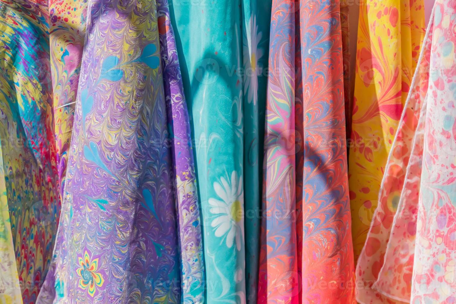 Range of colorful silk scarfs in the shop. photo