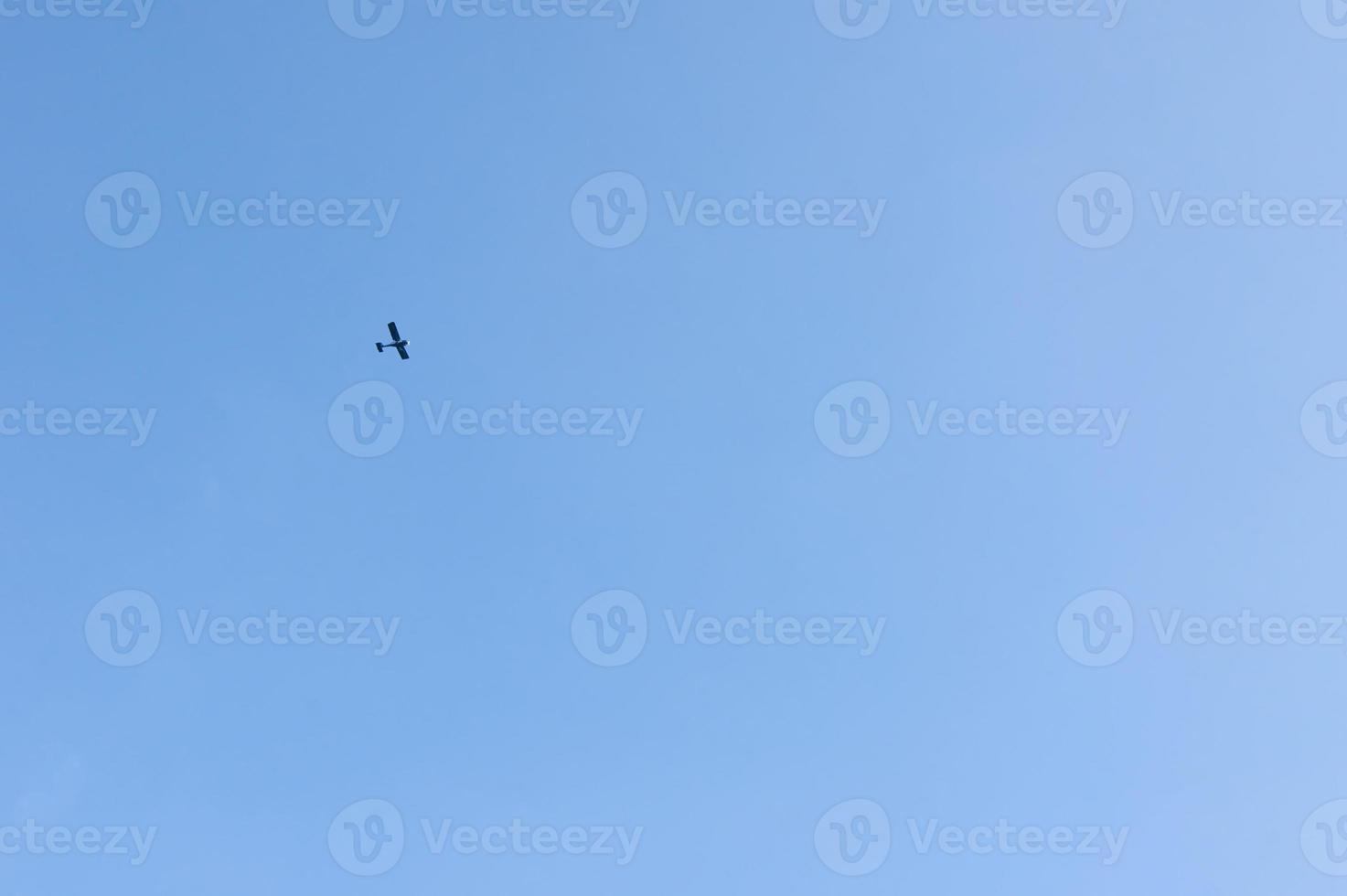 Beautiful gradient sky and motor plane on background. photo